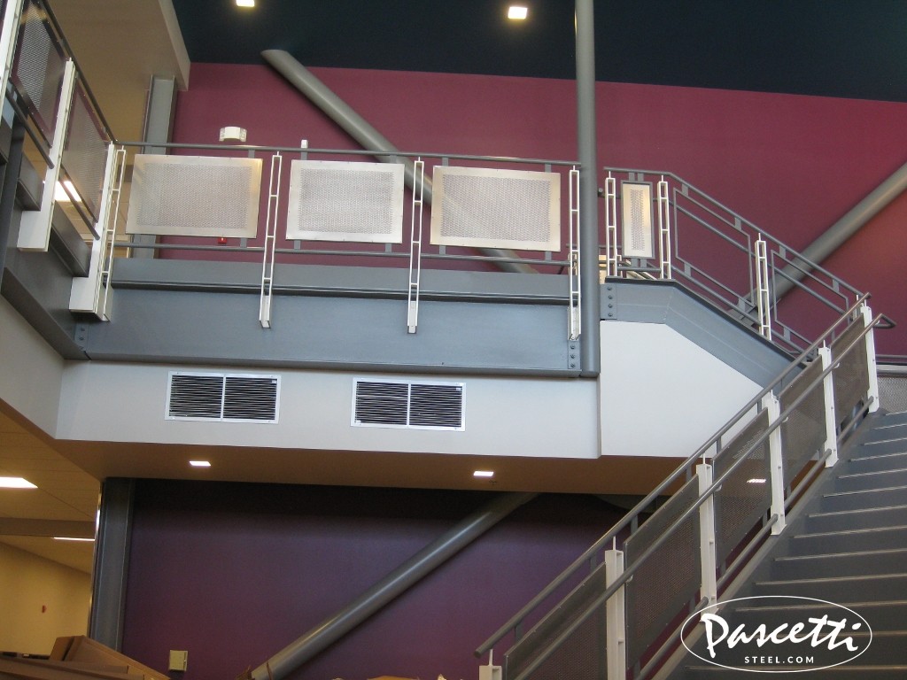 Commercial ADA compliant stair and handrail system with perforated metal panel infill