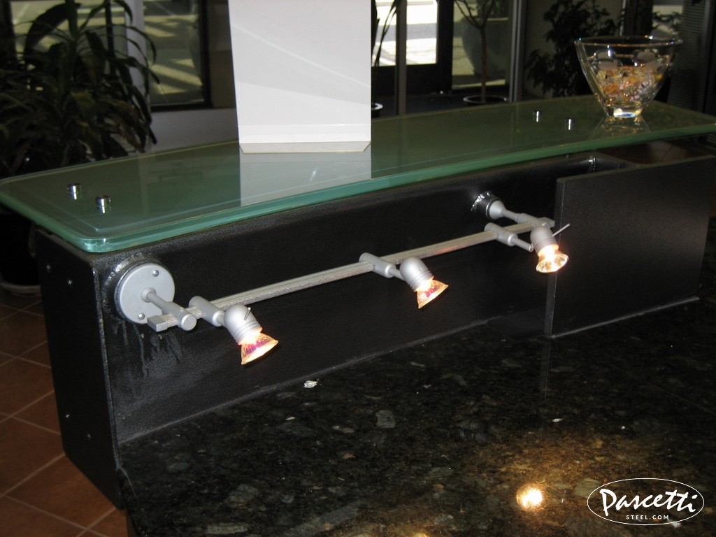 custom commercial steel reception desk area with integrated lighting