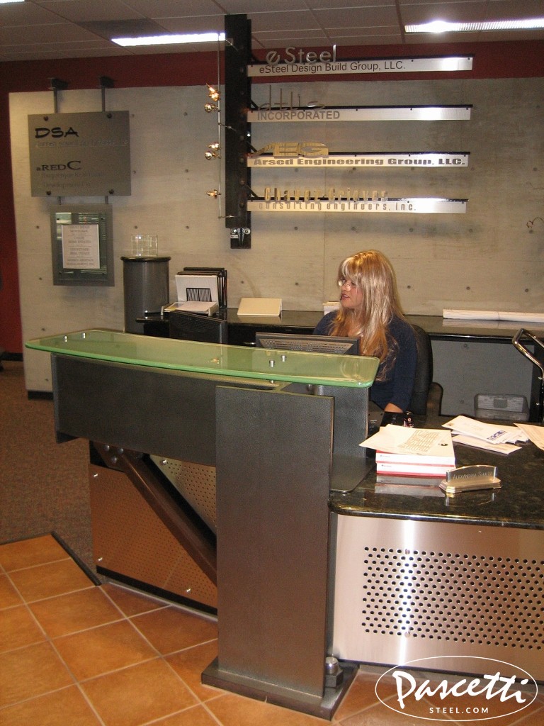 custom commercial steel reception desk area with integrated lighting