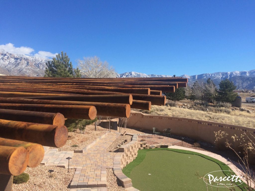 cantilevered shade structure with rust finish pipe latillas