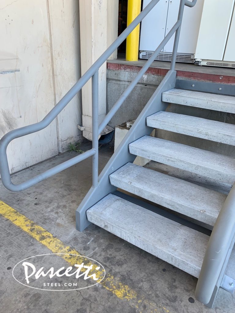 custom steel stair railing with concrete treads